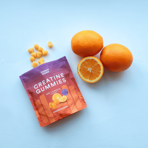Żelki z kreatyną monohydrat Yummy Gains smak pomarańczowy – opakowanie z pomarańczami